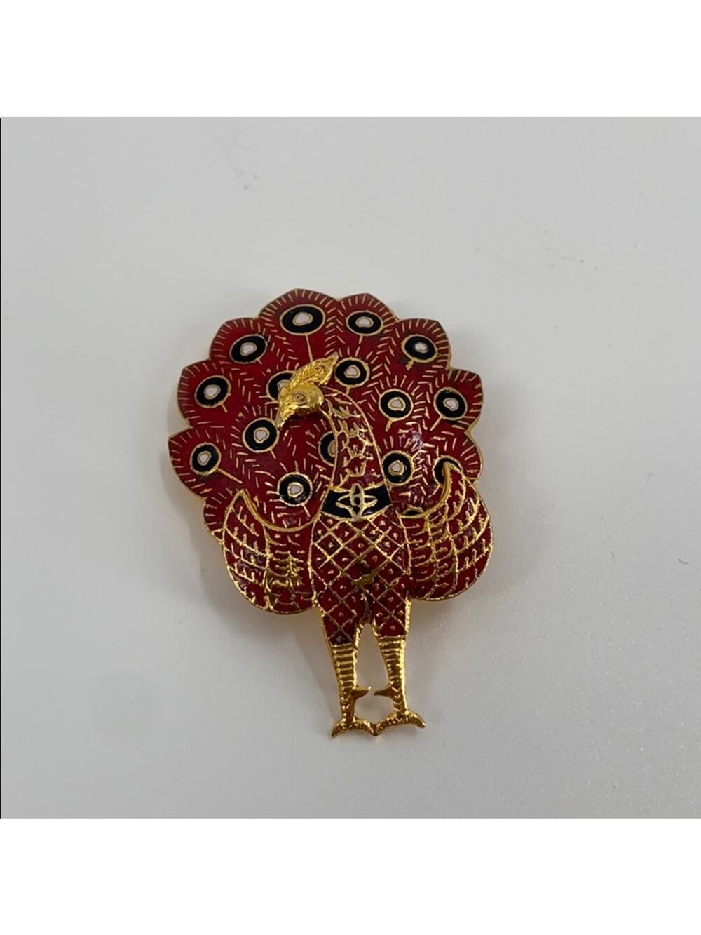 Vintage gold and red peacock brooch
